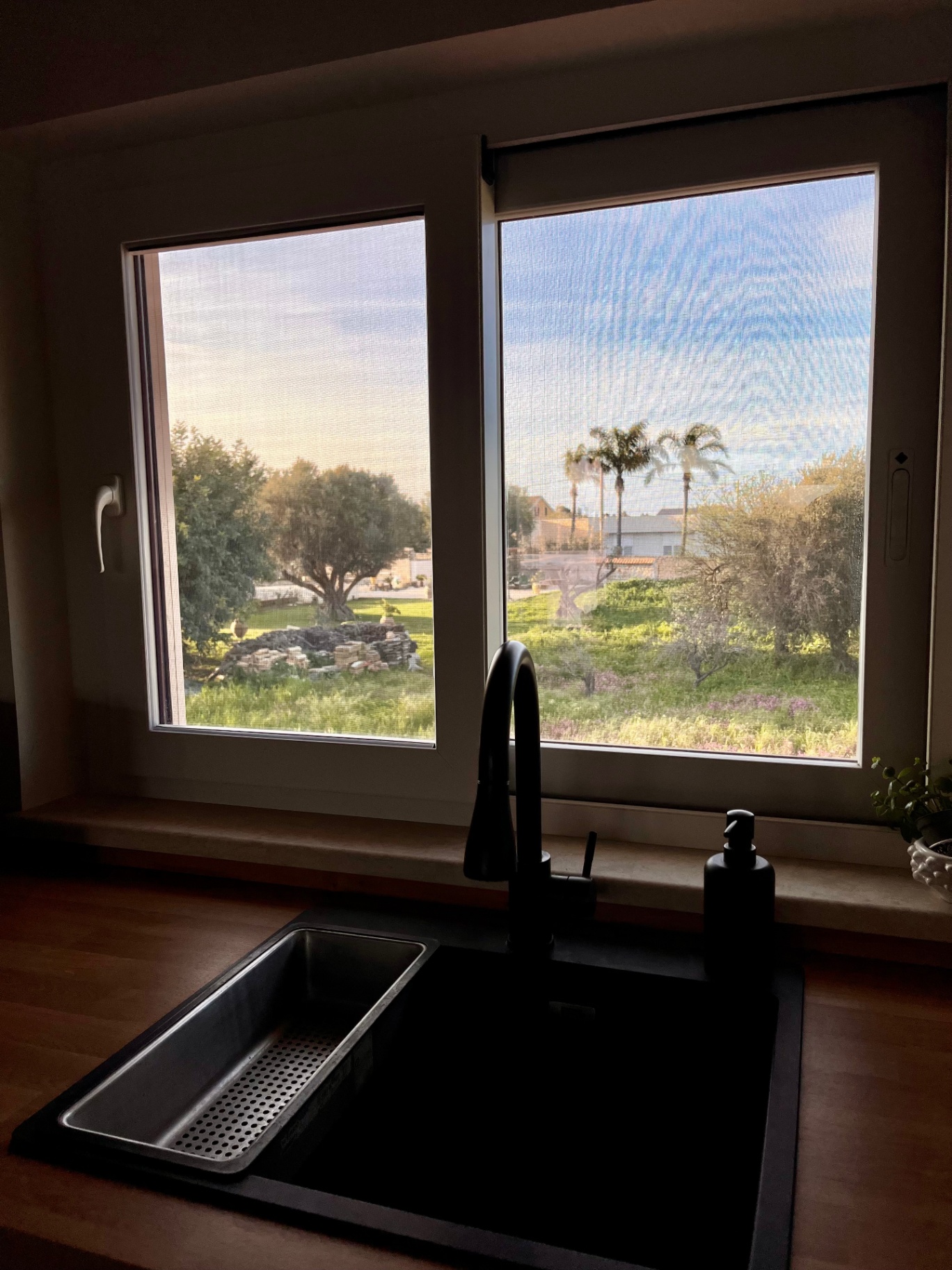 Open kitchen and living space at The Blue Window sea-view apartment, South-East Sicily